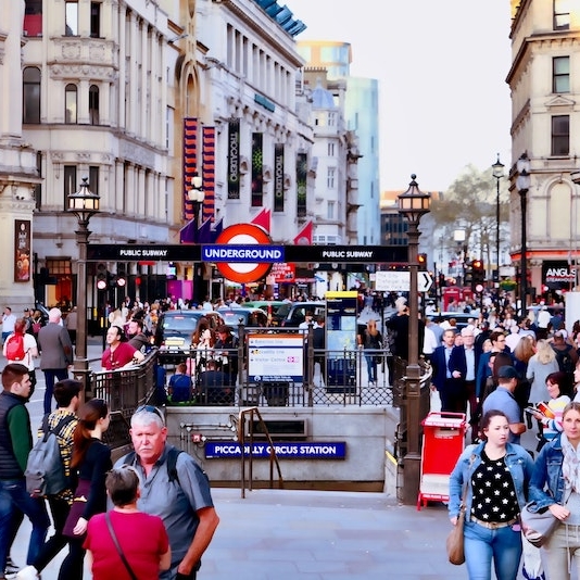 People walking near the Piccadilly Circus metro station in daylight